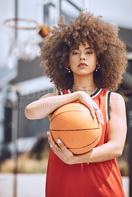 Buy stock photo Portrait of a basketball player woman on a court holding a ball outdoors and ready for a sports competition. Trendy and serious African American woman athlete with cool wellness style or fashion