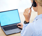 Call center, contact us and laptop of a woman employee or agent using her computer with headset in the office. Female worker in customer support or telemarketing at her desk ready for consulting.