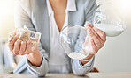 Business woman or manager with money and hourglass working in finance management at a company desk. Employee, worker or accountant collecting tax, cash or financial debt in a corporate office.