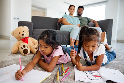 Buy stock photo Children drawing, notebook education and parents in living room to relax with kids on floor. Girl siblings writing, studying and doing homework in the lounge with mother and father in family home