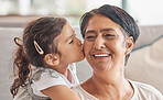 Love, family and kiss with girl and grandma together for happy, retirement or mothers day celebration. Smile, hug and  proud with child and grandmother at home in embrace for birthday or care