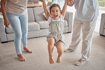 Buy stock photo Happy child jump on carpet with grandparents holding hands for support, love or care in living room. Excited kid girl with family with legs game or exercise for growth development with people helping