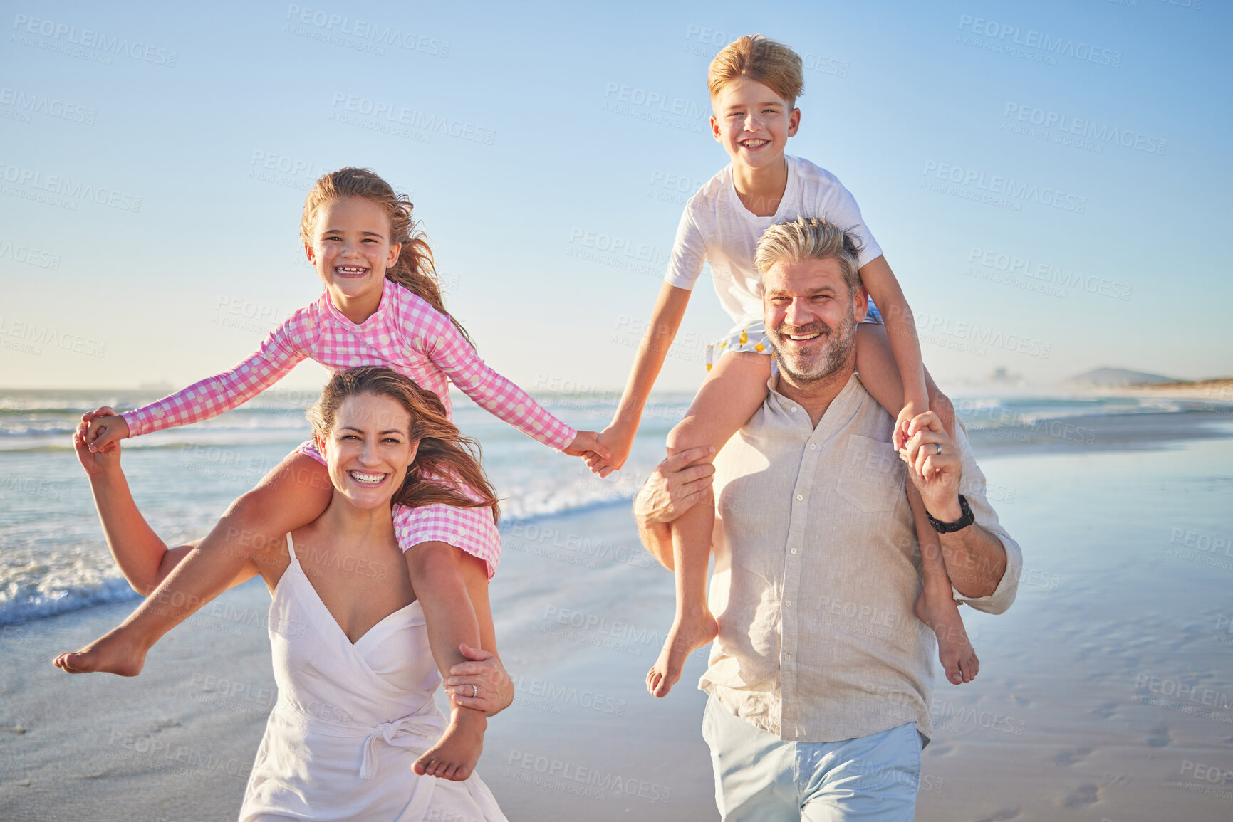 Buy stock photo Happy family walking on beach for outdoor wellness, holiday in summer sunshine with care, love and support on blue sky mock up, Healthy parents and children bonding in portrait for youth fun near sea