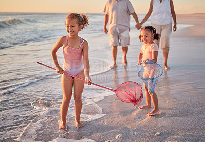 Buy stock photo Beach, fishing and children with parents in water for summer vacation, holiday or outdoor growth development and wellness. Happy, excited girl kids and fisherman people or family play with net in sea