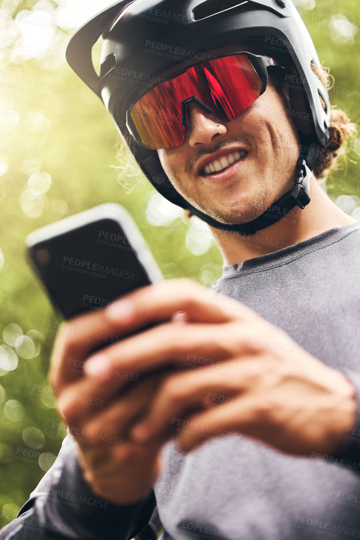 Buy stock photo Adventure, sports man with smartphone in forest check GPS location, fitness goal or progress on mobile app. Athletic in nature reading online results, web for triathlon tips on 5g network mobile app