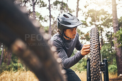 Buy stock photo Cycling, adventure trail and bike repair, man fix wheel in forest. Nature, mountain biking and cyclist, outdoor cycle maintenance in Australia. Bicycle ride, dirt path and biker stop for tyre change.