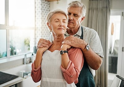 Buy stock photo Senior, couple and love in kitchen for embrace together in romance, care and bonding in home. Elderly man, woman and retirement show happiness, relax and happy look on face in house in Houston, Texas