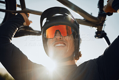 Buy stock photo Cyclist, lift bike and smile for celebration after winning race, tour or competition with helmet on head. Man, bicycle and sunglasses after win in sports to show happiness in summer sunshine