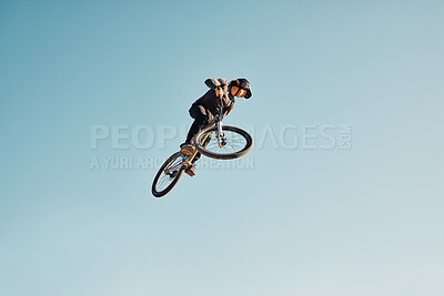 Motorcycle stunt, man cycling in air jump on blue sky mock up for sports action performance, fitness training or outdoor bike performance. Professional sports person with bmx bicycle adventure mockup