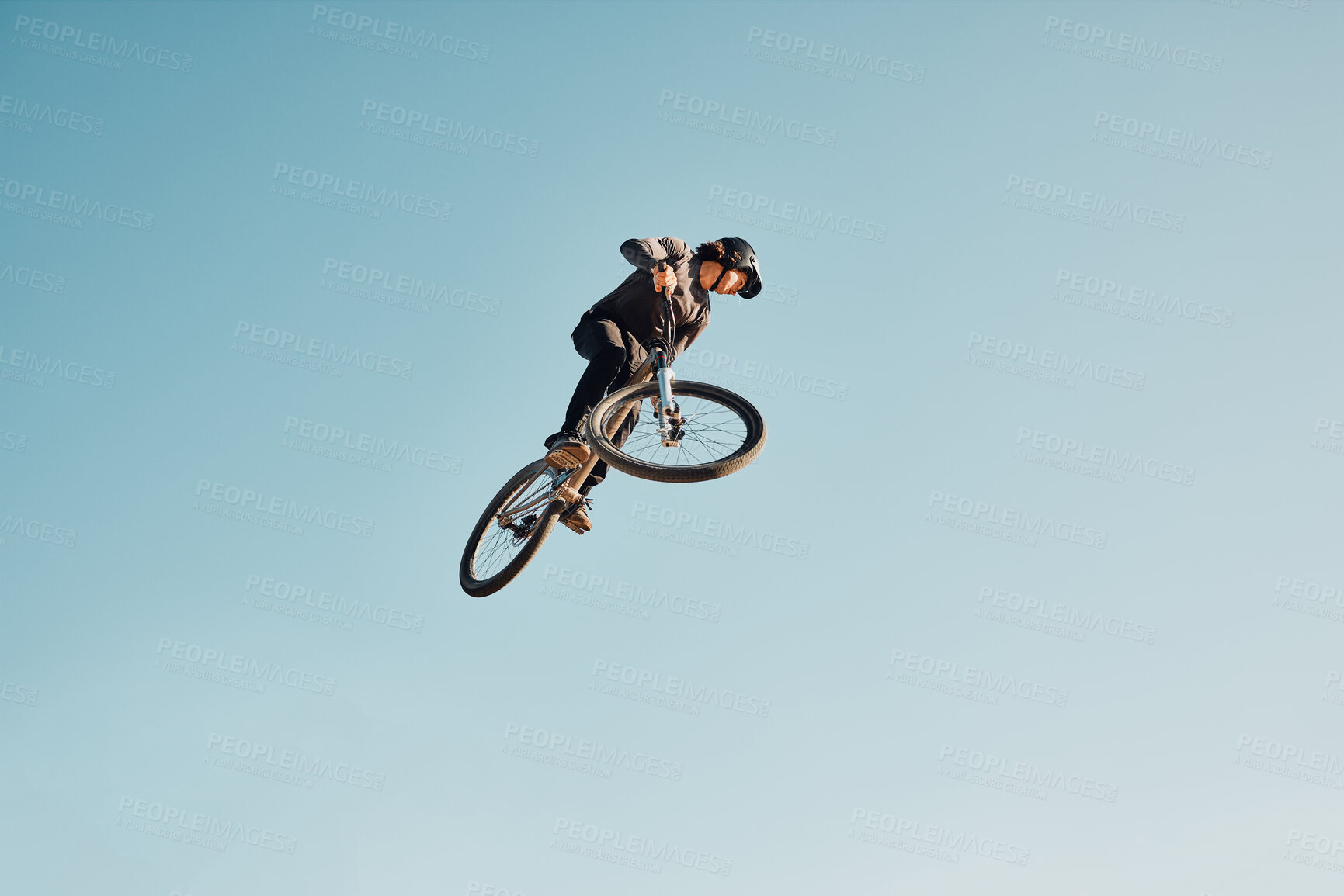 Buy stock photo Motorcycle stunt, man cycling in air jump on blue sky mock up for sports action performance, fitness training or outdoor bike performance. Professional sports person with bmx bicycle adventure mockup