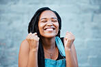 Black woman, happy and excited smile of a female from Jamaica feeling happiness. Smiling face of a person with excitement, positive energy and gratitude mindset with a gray brick background
