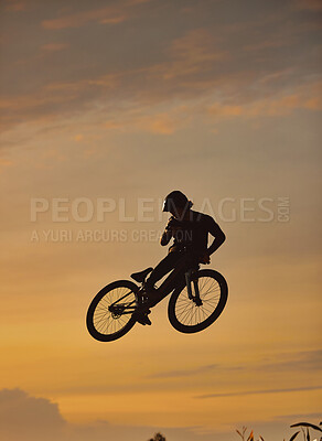 Buy stock photo Mountain bike, cyclist and fitness jump at sunset in Colorado countryside nature in workout, exercise or training. Danger risk, extreme bmx sports or freedom cycling man in sunrise with stunt energy