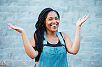 Black woman, smile and hands for confused or unsure gesture posing outside against urban city background in street against blue wall. Laughing female asking question showing and confused sign outside