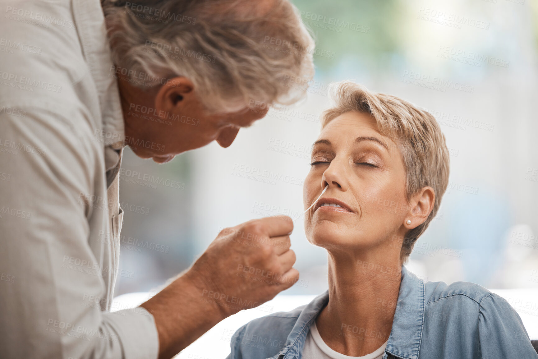 Buy stock photo Covid, health and senior couple with pcr test in home for corona virus compliance, wellness or safety together with easy check. Care, love and support elderly people with covid 19 nose medical swab
