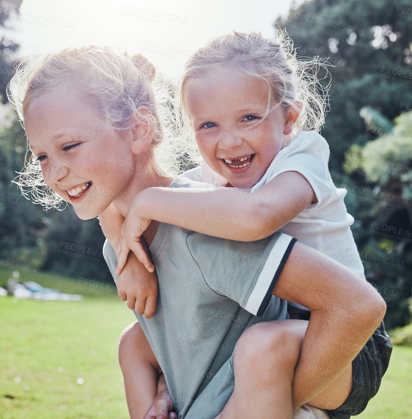 Buy stock photo Happy, smile and siblings in an outdoor park during summer having fun and playing in nature. Happiness, excited and girl children on an adventure giving a piggy back ride outside in a green garden.