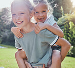 Children, smile and sister piggy back girl outdoor being playful, happy or relax together for summer holiday. Siblings, sisters and playing excited on grass, kids have fun and enjoy play date or game