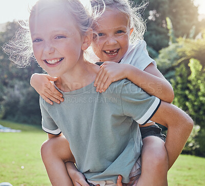 Buy stock photo Children, smile and sister piggy back girl outdoor being playful, happy or relax together for summer holiday. Siblings, sisters and playing excited on grass, kids have fun and enjoy play date or game
