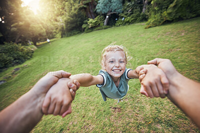 Buy stock photo Child spinning from hands in park, pov and happy summer evening. Fun time, motion and girl in garden swinging from arms, support from dad in nature. Kids, grass and swing from hand in field in Sweden