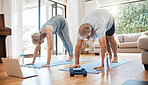 Fitness, laptop and retirement with couple in living room in virtual class for health, yoga or exercise. Internet, workout and pilates with old man and elderly woman training in home gym for wellness