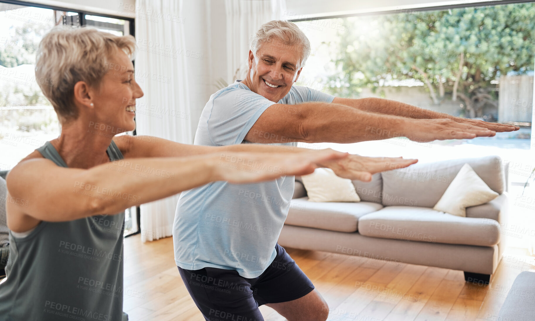 Buy stock photo Fitness, retirement and couple squat in home for senior body wellness and vitality in Canada. Happy elderly people in marriage enjoy stretching workout to bond together in living room.


