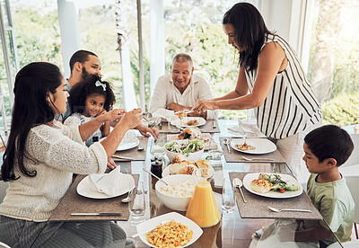 Buy stock photo Lunch, eating food and big family in their Mexico home dining room table for summer reunion or quality time together. Puerto Rico mother, grandparents and children with chicken, salad and bread meal