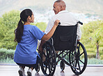 Healthcare, disability and man in wheelchair with nurse on retirement or nursing home patio. Senior care, happy disabled grandpa and woman caregiver with smile outside in garden at hospital or clinic
