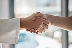 Handshake, deal and business partnership or agreement, closeup at office window. Shaking hands, thank you and a corporate welcome to new recruit or partner. Hand shake at meeting for collaboration