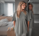 Bipolar, depression and scared young woman in a bedroom with worry, fear and stress. Insomnia, mental health problem and patient in pain with blur motion, anxiety and schizophrenia at mental hospital