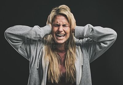 Buy stock photo Stress, screaming or crying woman with hands over ears on black background in studio with mental health, anxiety or schizophrenia. Psychology, depression or shouting patient in counseling help asylum