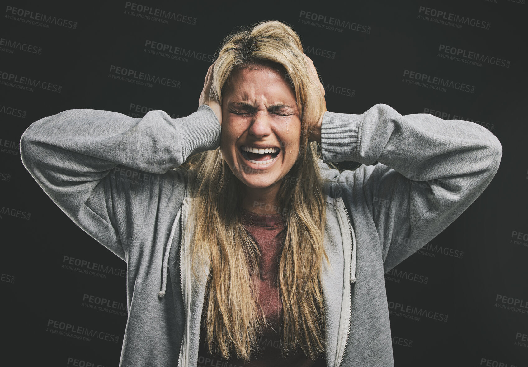 Buy stock photo Stress, screaming or crying woman with hands over ears on black background in studio with mental health, anxiety or schizophrenia. Psychology, depression or shouting patient in counseling help asylum