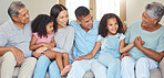 Love, happy family and relax on a sofa, laughing and bonding in a living room together in their family home. Kids, grandparents and loving parents enjoying free time and conversation together indoor