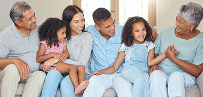 Buy stock photo Love, happy family and relax on a sofa, laughing and bonding in a living room together in their family home. Kids, grandparents and loving parents enjoying free time and conversation together indoor