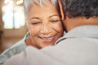 Buy stock photo Love, smile and elderly couple hug in their home, happy and relax while bonding and embracing. Care, affection and calm mature man and woman enjoying romance, intimacy and retirement in their home