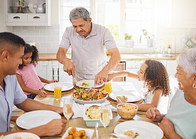 Buy stock photo Family lunch, home celebration and grandparents hosting a dinner at kitchen table for children with turkey chicken. Girl kids, father and senior people eating food together with love in their house