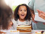 Wow, party and birthday cake with girl surprise, happy and excited in celebration with people. Family, children an cheerful Latino child smile, sweet and happiness ready for a snack at a social event