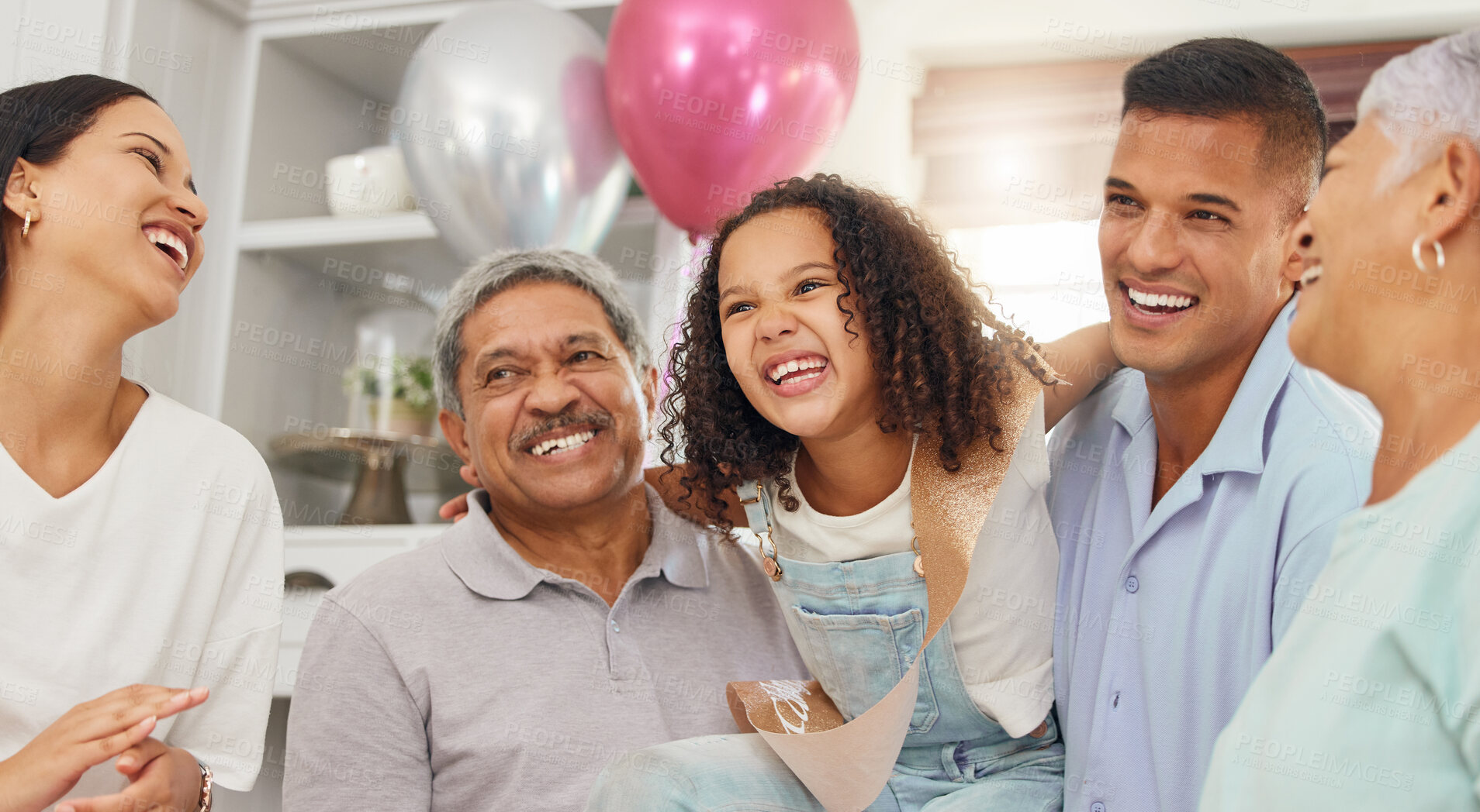 Buy stock photo Happy birthday, party and girl in celebration with family as her mother, father and grandparents enjoy a special day together. Dad, mom and excited child celebrating with an elderly woman and old man