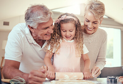 Buy stock photo Learning, family and girl baking with grandparents in a kitchen, bonding while prepare cookies together. Teaching, learn and child development by senior man and woman showing child how to bake snack