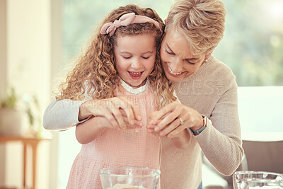 Buy stock photo Children, family and baking with a girl learning and grandmother cooking in a kitchen of their home together. Kids, food and ingredients with a senior woman teaching her granddaughter to make a meal