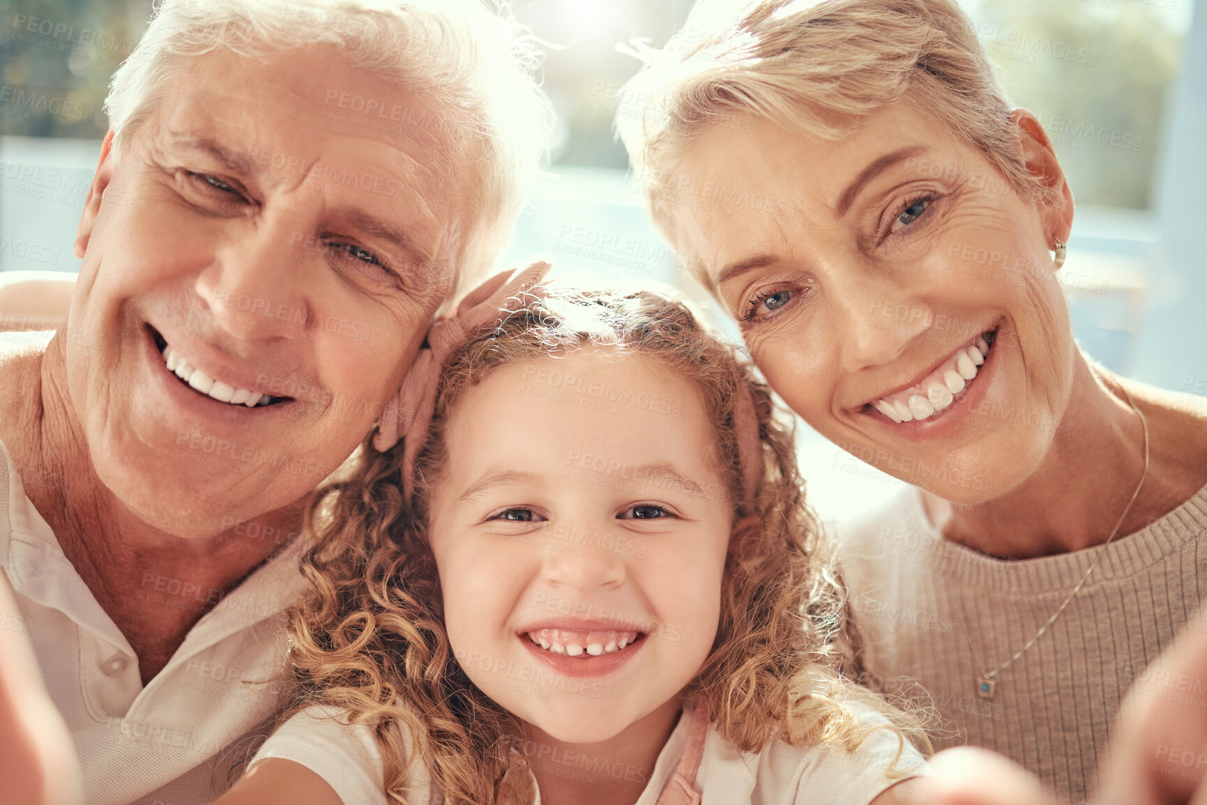 Buy stock photo Phone selfie, grandparents and girl child family love to smile, happy and bonding together in support, care and happiness. Excited kid, retired senior grandma and grandfather take social media photo