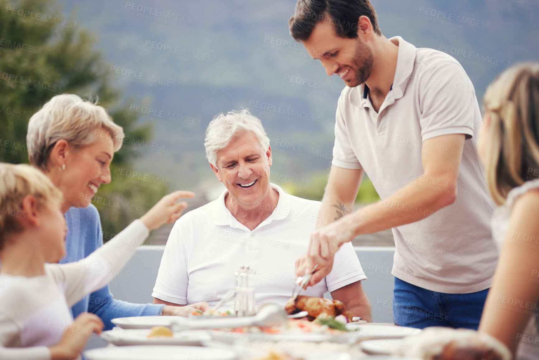 Buy stock photo Family eating lunch outdoor garden for holiday celebration, fathers day or thanksgiving turkey food. Happy, care and love people with grandparents and child brunch together in garden to celebrate dad