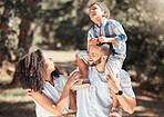 Love, relax and happy family laughing and bonding on outdoor walk in a park, cheerful and carefree. Playing, smiling and excited boy enjoying free time with his loving parents in nature on weekend