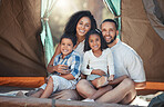 Happy family, children and camping in tent for fun, adventure and bonding with mom and dad on trip in nature. Portrait of woman, man and children together to relax on summer camp or vacation outdoors