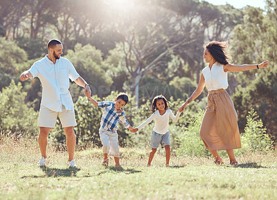 Buy stock photo Freedom, happy family and fun in a park with black children and parents bonding and playing on grass. Love, energy and kids excited and happy while enjoying a fun dancing activity with mom and dad