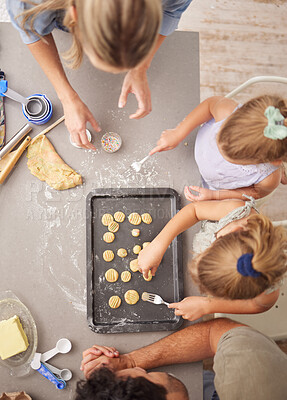 Buy stock photo Baking, family and girl children learning to bake cookies in kitchen at home from above with mom, dad and sister. Man, woman and kids having fun with dough, cooking and food together making pastry