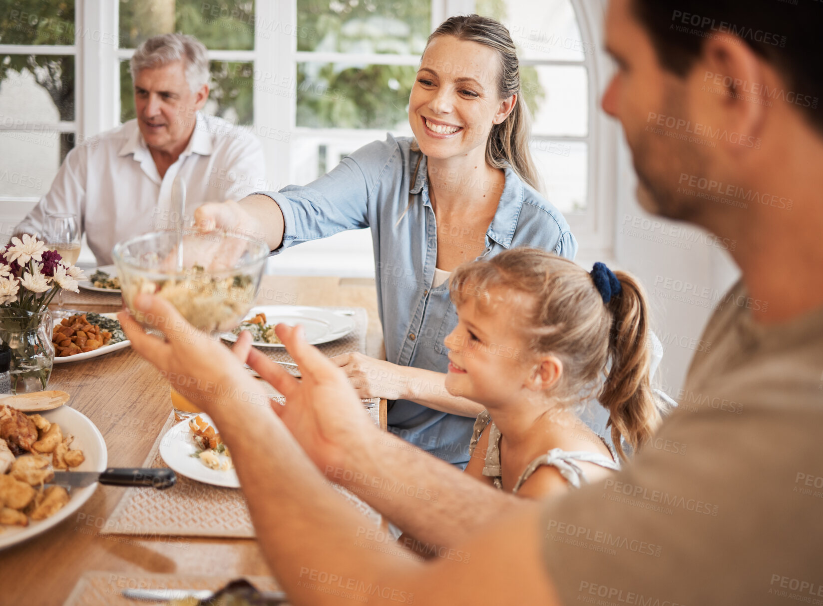 Buy stock photo Family, food and lunch meal with child, parents and grandparents sitting together for holiday memories at dining table at home. Happy, bonding and love with men, woman and girl in their Canada house