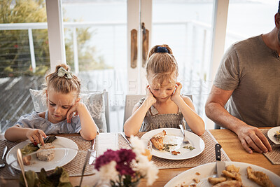 Buy stock photo Picky eating kids frustrated with lunch food, fussy at dinner table and struggle in family home with diet. Mad, moody and upset young girl children refuse to eat disgusting, dislike and annoyed meal