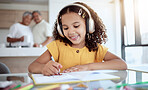 Girl, home and music while drawing in book for homework, assignment or fun in family home. Child, writing and notebook while happy with headphones for audio, radio or streaming in grandparents house