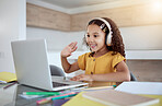Education, laptop and girl learning a virtual class from her kindergarten teacher via an educational online website. Video call, homeschooling and happy student in headphones waving at tutor teaching