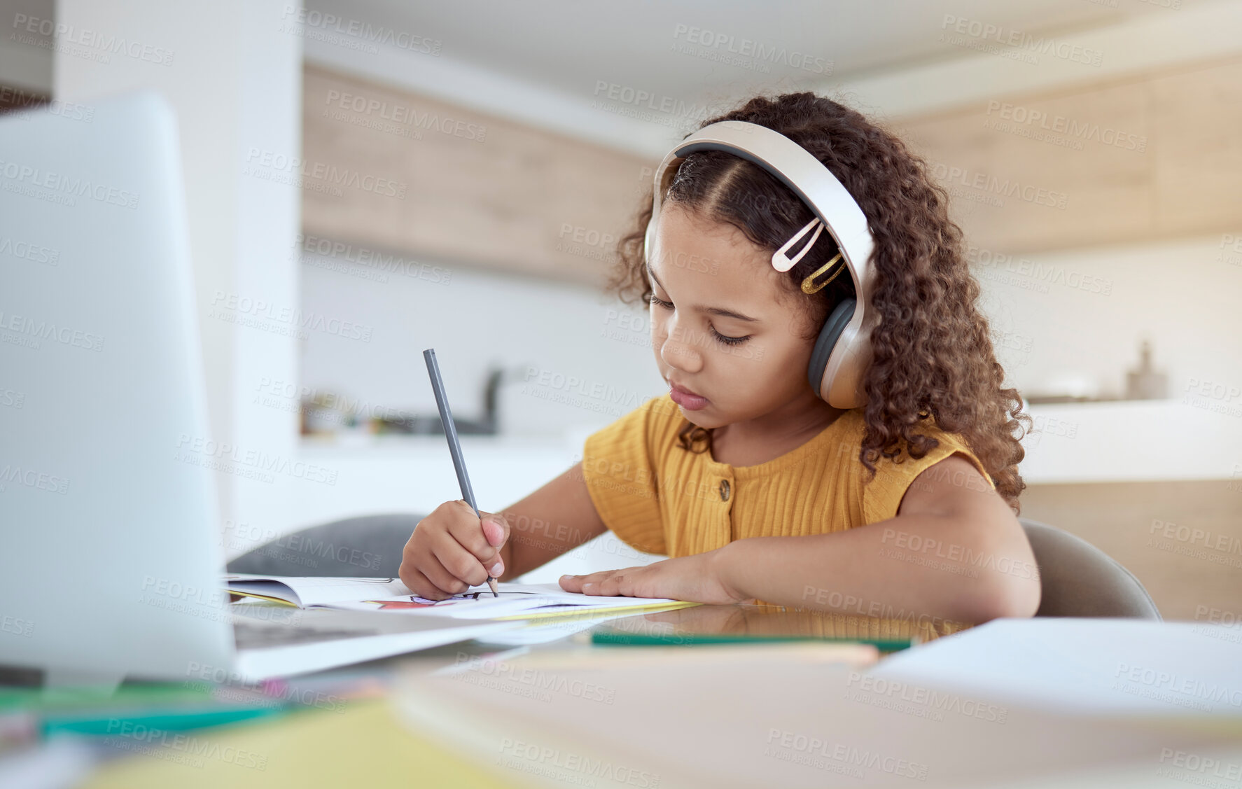 Buy stock photo Children, education and writing with a girl student distance learning from home on a laptop for homework or study. Kids, book and school with a child at her desk to learn for growth and development