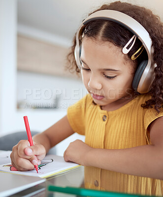 Buy stock photo Girl, home and music while drawing in book for homework, assignment or fun in home. Child, writing and notebook while creative with headphones for audio, radio or streaming with homeschool in house